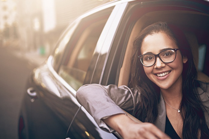 girl with arm resting on open car window