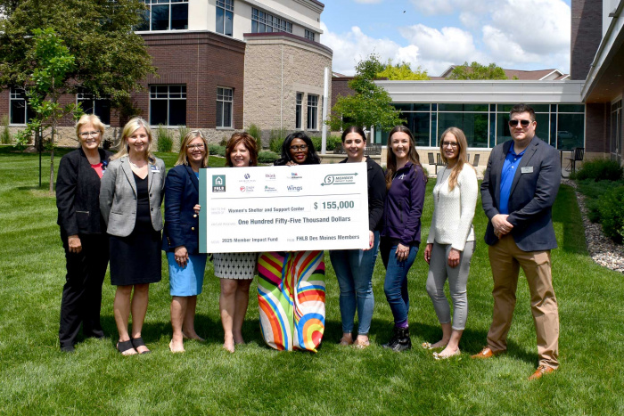 representatives from various financial institutions presenting donation check
