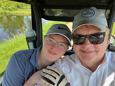 Steve Flage and his son golfing